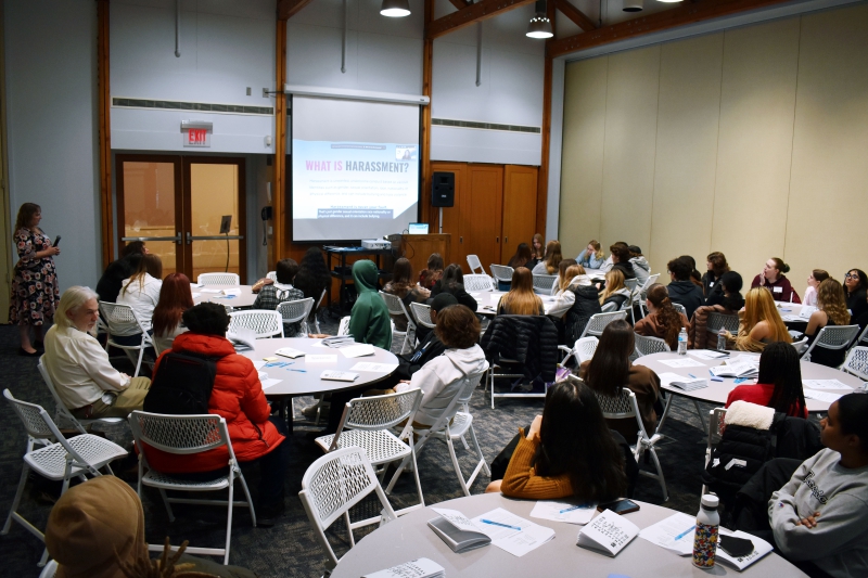 Students listen to a presentation and discussion on harassment in the Bystander Intervention breakout session.