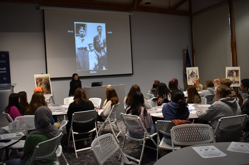 Students listen to a story about a 3GNY member’s grandmother, Masha, a Holocaust survivor.