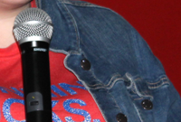 [PIC] Alternative High School Student Sings Into Microphone Thumbnail