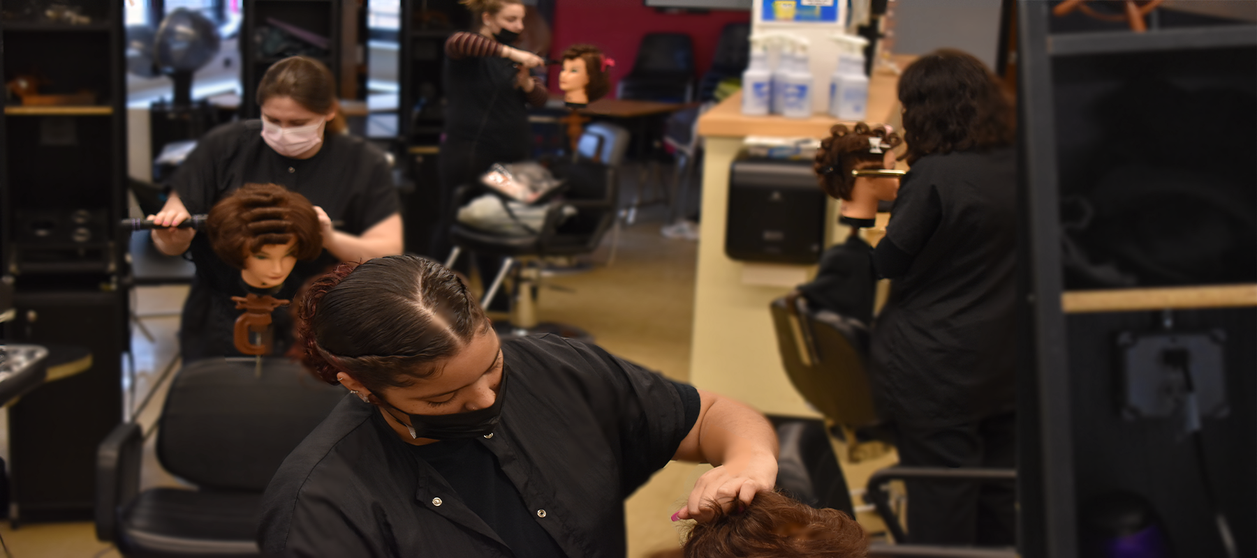 4 students doing hair.png