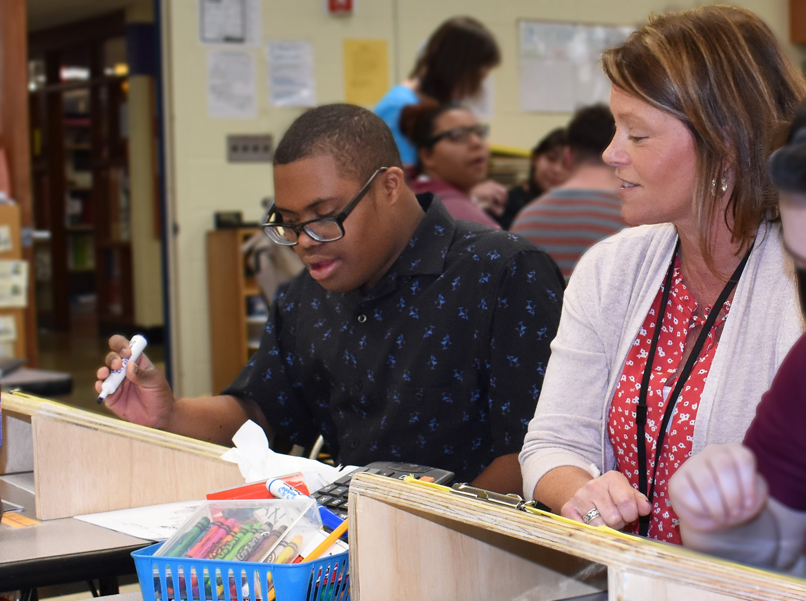 Pictured are Construction Trade students from the Dutchess BOCES Career and Technical Institute and students who use slant boards to improve writing along with occupational therapist Lisa Serlin