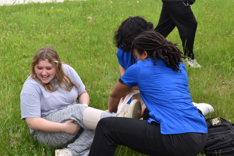 Nursing Assistant students treat an ‘injured’ Security and Law student during the exercise.