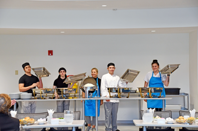 Dutchess BOCES Culinary Arts and Restaurant Management students and staff open the buffet for dinner.