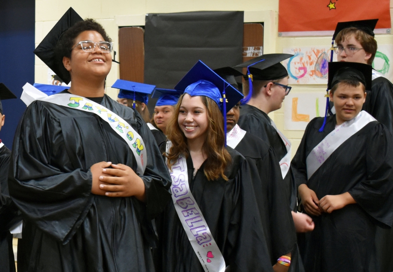 Students moving on to high school from SPC are full of smiles during their moving up ceremony.