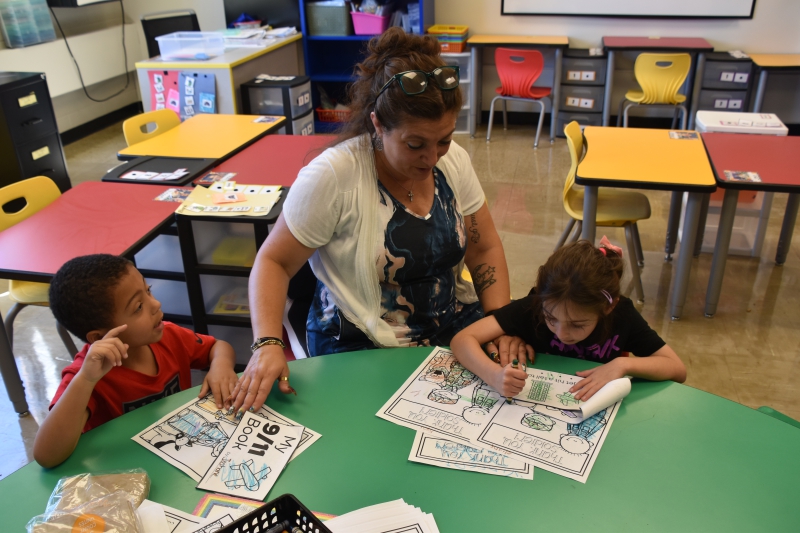 Salt Point Center students color pictures of soldiers, police officers and firefighters in honor of 9/11