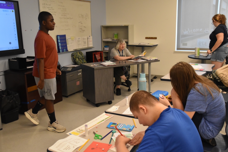 Teacher Tracey Smith reads a portion of "Diary of a Wimpy Kid" aloud to her class.