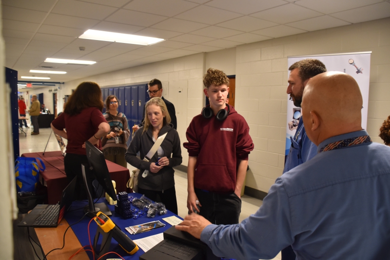 Representatives from ConEd speak with attendees about opportunities with the utility company.