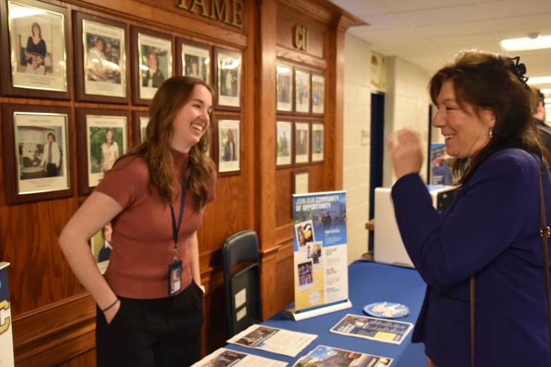 Dutchess County Executive Sue Serino, who co-hosted the fair with BOCES, shares a laugh with a representative from Dutchess Community College.