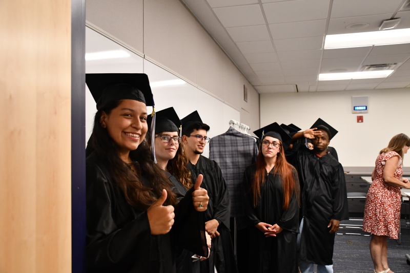 GED graduates line up before entering the ceremony.