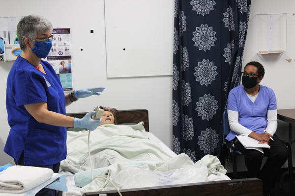 [PIC] Dutchess BOCES Adult Learning Institute Nursing Assistant Instructor Susan DeMan Demonstrates For One Of Her Nine Students