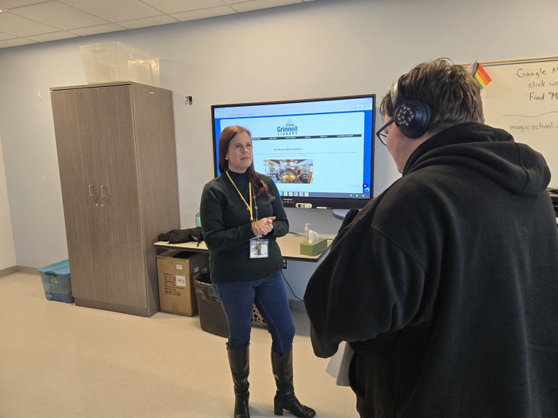 Resilience Academy student Dylan Seaboldt speaks with Grinnell Library Director Kristen Campbell in class.