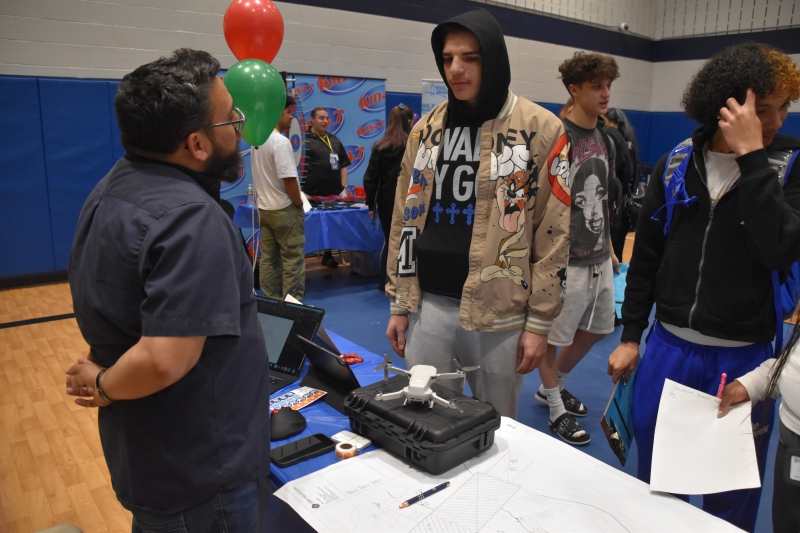 Students speak with Sheely Roofing about what job opportunities are available.