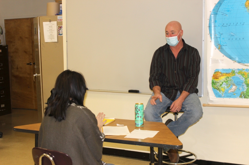 HSE instructor Richard Petschko speaks with a student in the HSE program