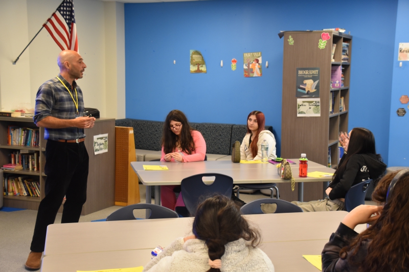 NAMI Program Coordinator and Lead Presenter Rob Brown speaks to Resilience Academy student Bella during the presentation.