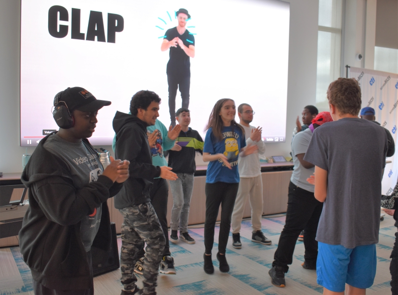 Students dance the "Cha Cha Slide" to end the show.