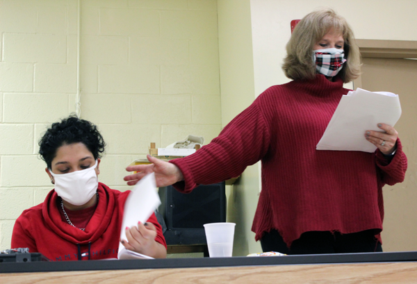 [PIC] Dance and Theater Instructor, Kathy Muenz, directs a student through a recording of a radio drama 