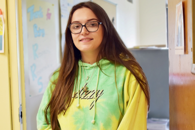 Student Claudia Hill outside her Participation in Government class.