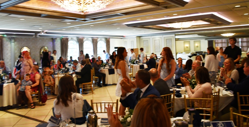 Distinguished Graduates from the Class of 2026 stand to applause at the 2026 Dutchess BOCES Distinguished Graduate Recognition Breakfast