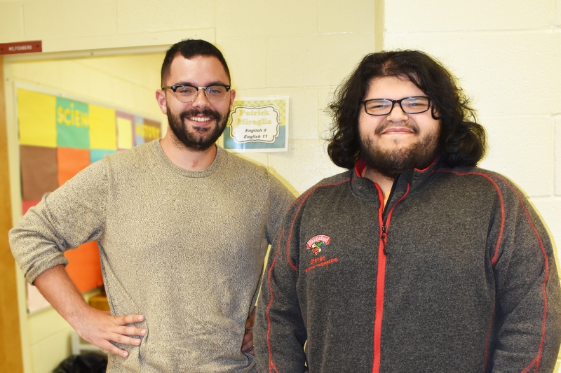 Teacher Patrick Miraglia stops for a photo with student William Sturdivant