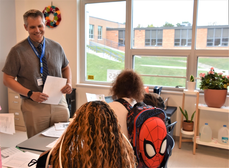 Resilience Academy's first Dean of Students speaks with students in a class.