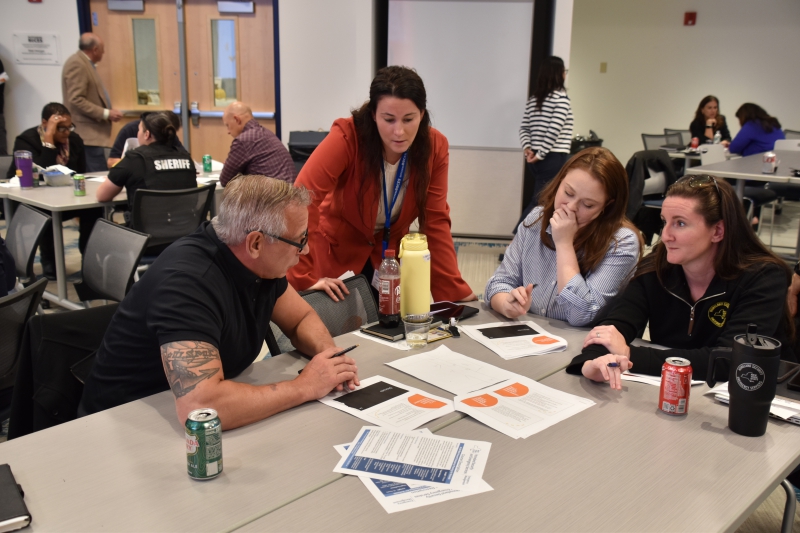 Dutchess BOCES Director of School Safety and Security Jacqueline Fama speaks with a group during the tabletop.