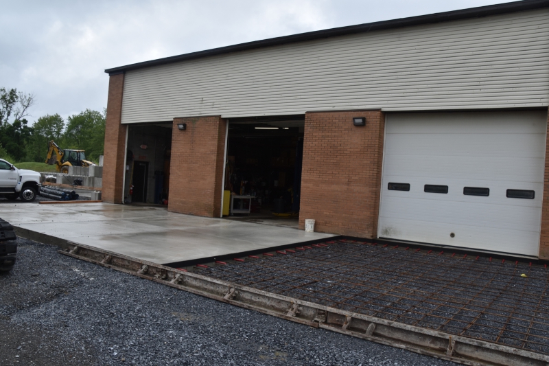 One of two concrete pads being built by the Facilities and Operations garages to provide a space for washing vehicles.