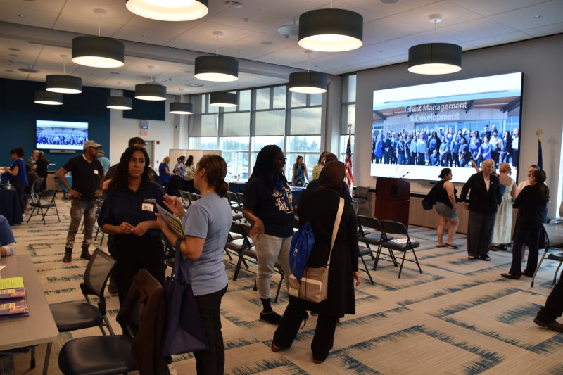 Attendees at the Utility Bill Clinic discuss options with representatives from different agencies and nonprofits about how they might be able to save money on utilities, food costs and housing.