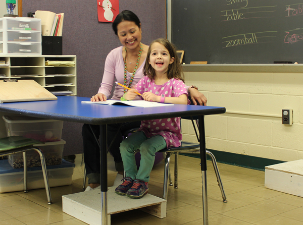 [PIC] Pegasus Program Occupational Therapsit Sitting And Working With A Young Student