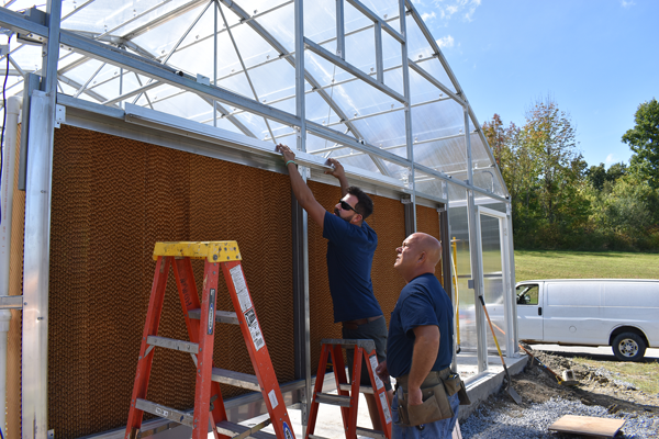 [PIC] Facilities & Operations Staff Work On Greenhouse Framework