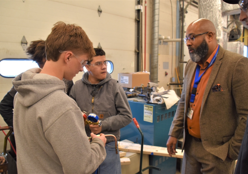 New CTI Principal Jason Lloyd speaks with students in the HVAC program during a classroom visit.