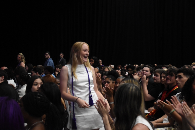 Cosmetology student Julia Tarkos stands up as her name is called.