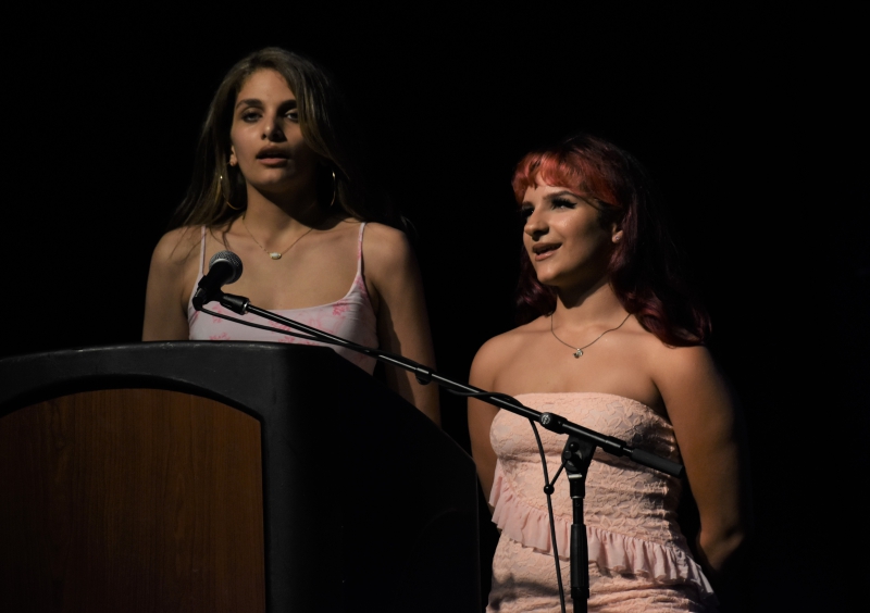 Nevaeh Pittman and Annalise Perez sing the national anthem to open the ceremony.
