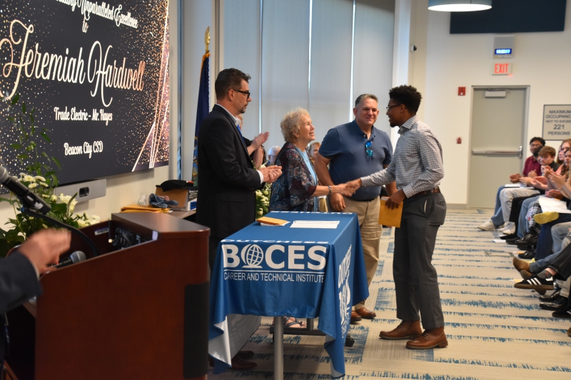 CTI Trade Electric student Jeremiah Hardwell accepts an award presented by the Dutchess BOCES Education Foundation and 7x24 Exchange.