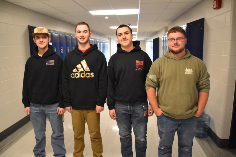 Schuyler Rawls, Erik Berg, Noel Soto and Matthew Ricks pose for a photo before heading out to the SkillsUSA States Competition. 