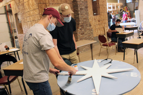 [PIC] Career Technical Institute Construction Trade Students Work On A Large Painted Compass