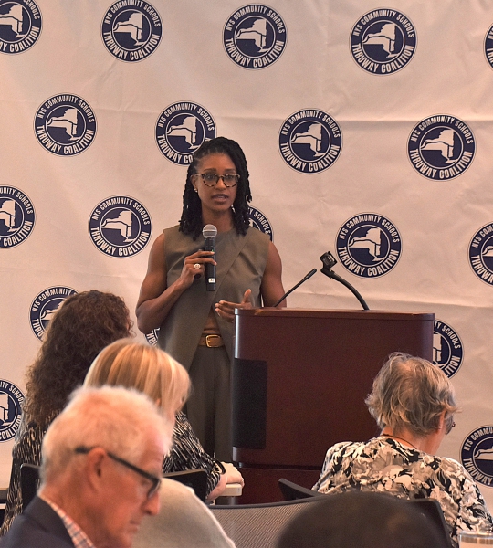 Ashley Cross, founding executive director of HOPE585, speaks at the Transformational Community Schools event.