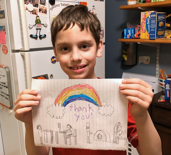 [PIC} Salt Point Center Student Displays His Drawing of A Thank You Rainbow