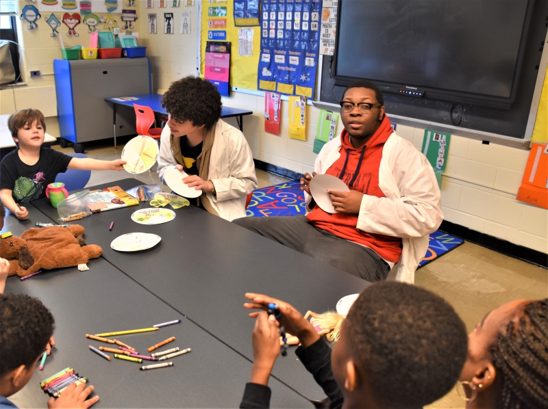 SPC student Jeremy Fischetti shows his season wheel to the class and his CTI student instructors