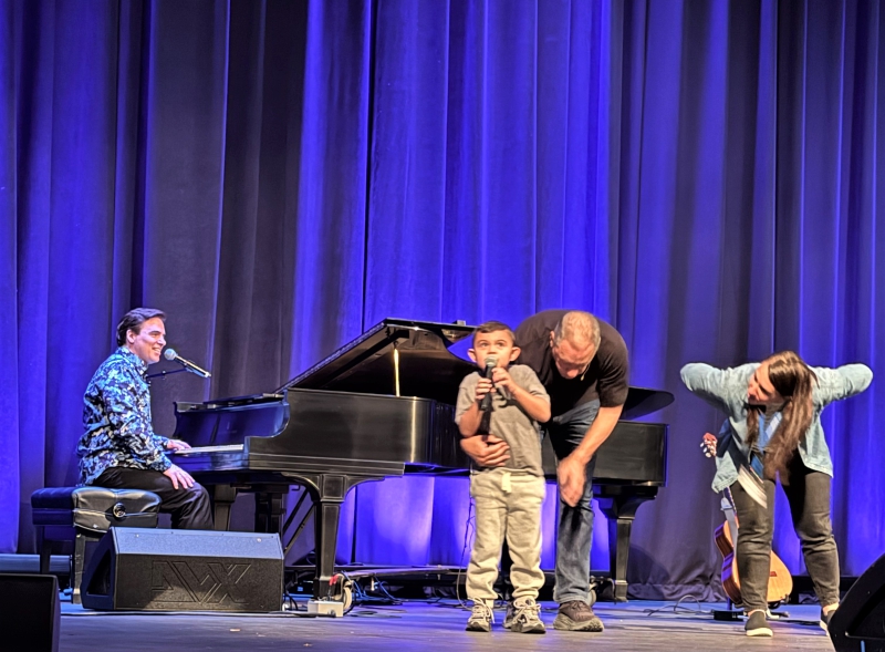 SPC student Shane joins musician and storyteller David Gonzalez on stage at the Bardavon.