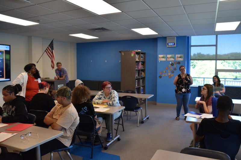 Incoming freshman Reagan Albach asks Resilience Academy Principal Kiesha Tillman a question during a tour of the school.