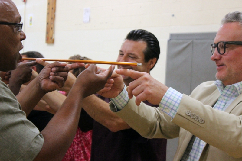 Incoming Superintendent Jason Schetelick (far right) participates in a team building exercise